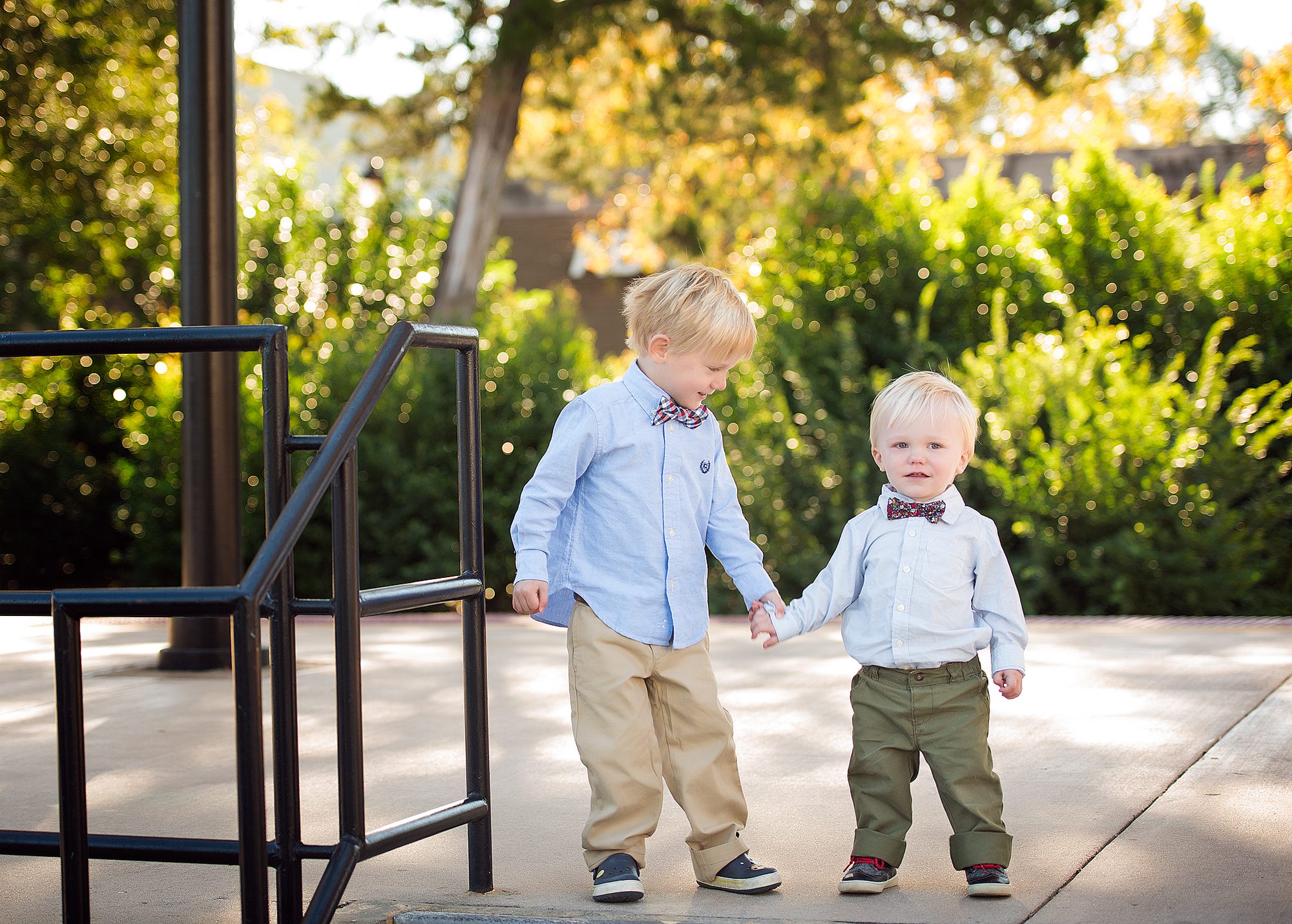 two brothers holding hands