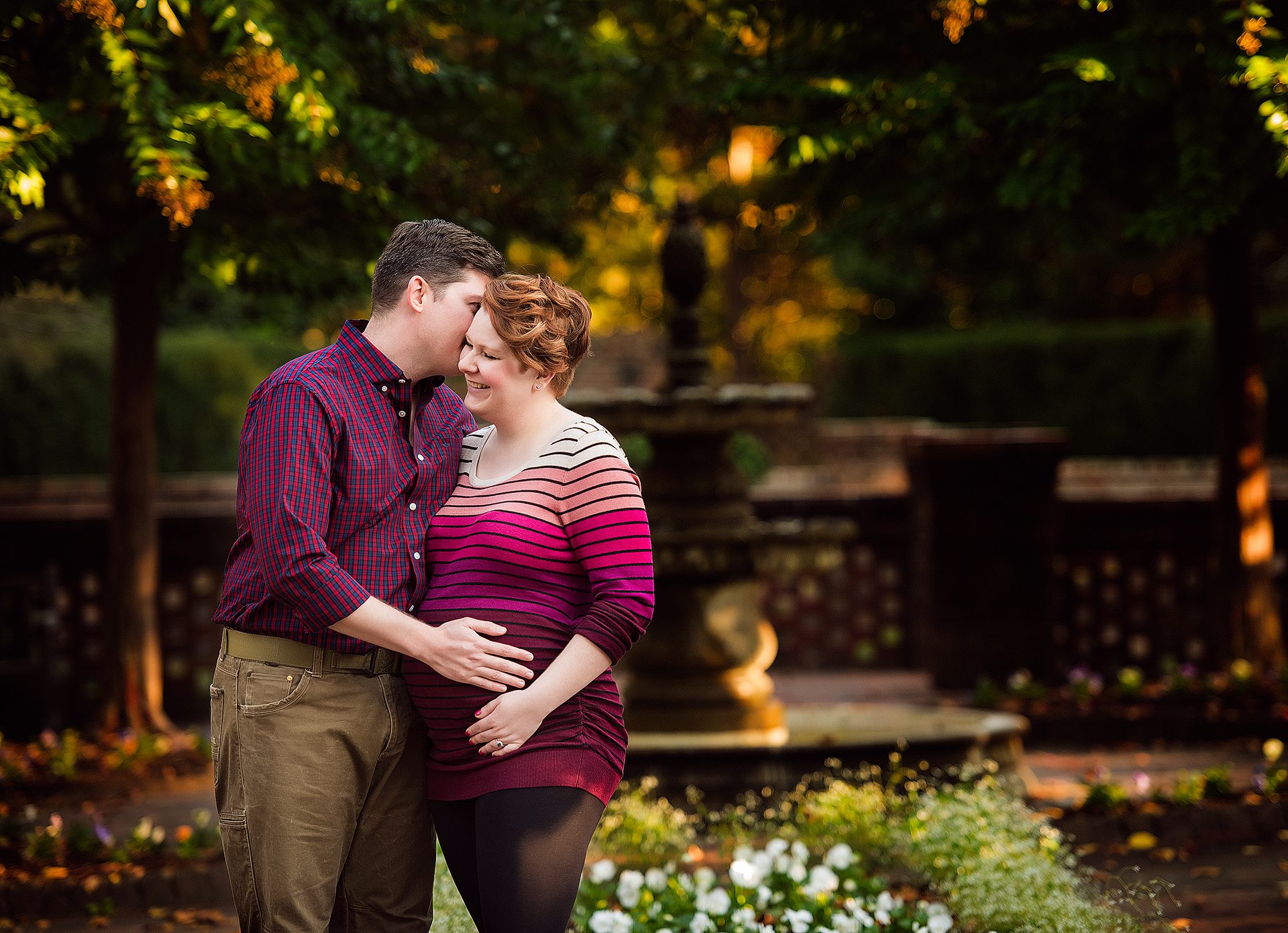 dad and mom embracing at a maternity session