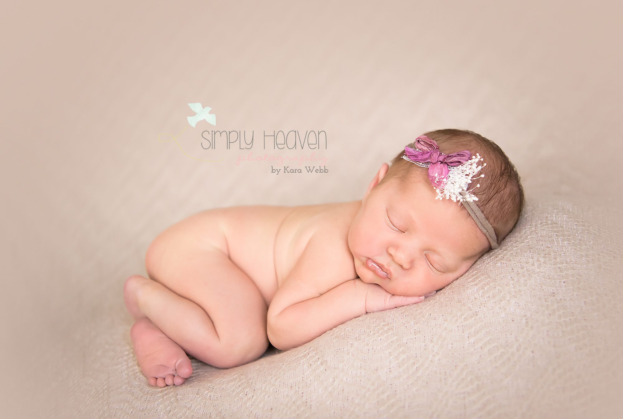 newborn baby girl with a headband