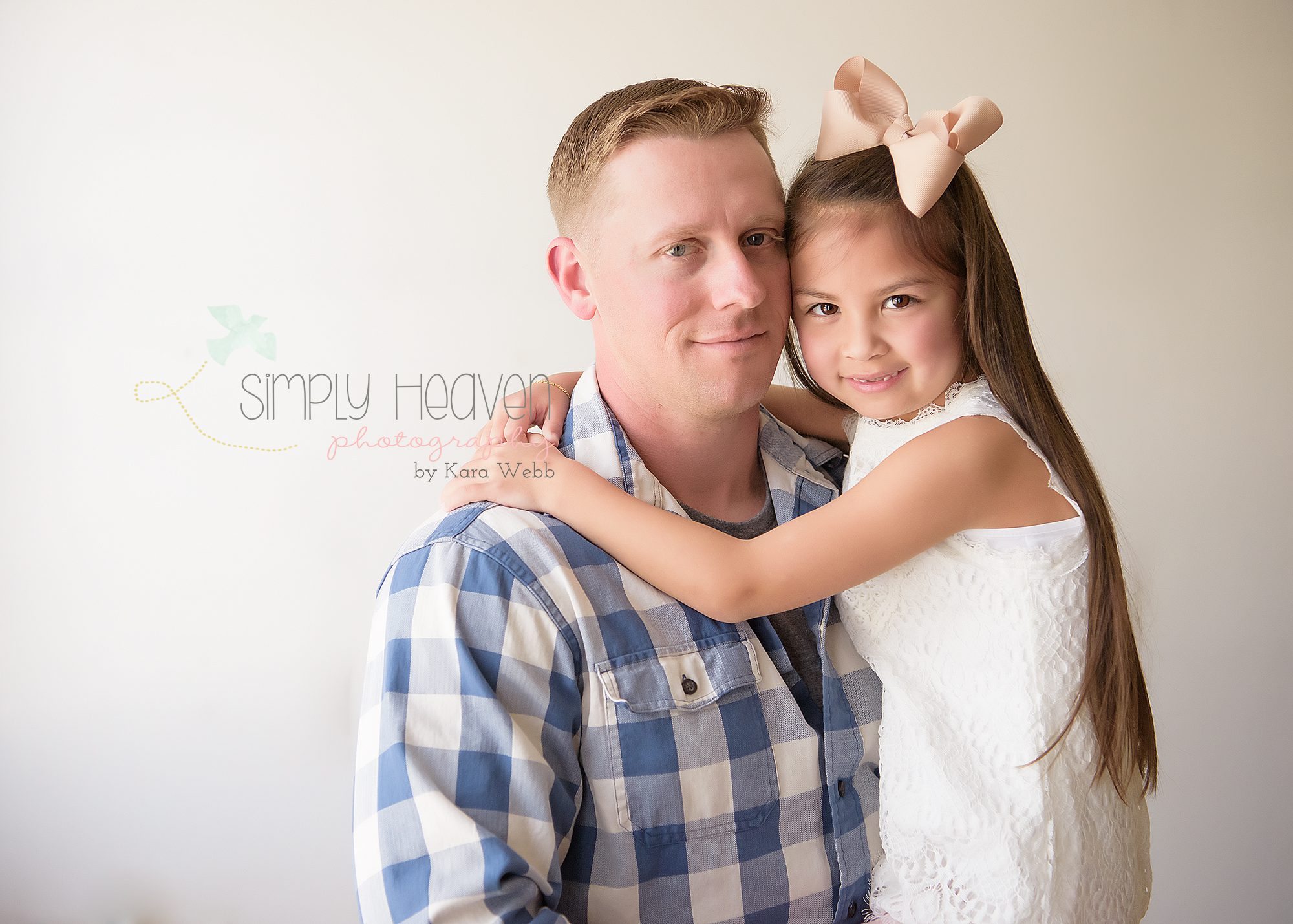 dad holding his daughter