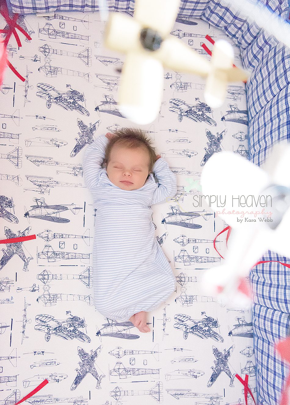 newborn baby boy sleeping in his crib