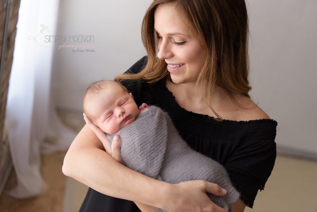 mom holding a newborn baby boy