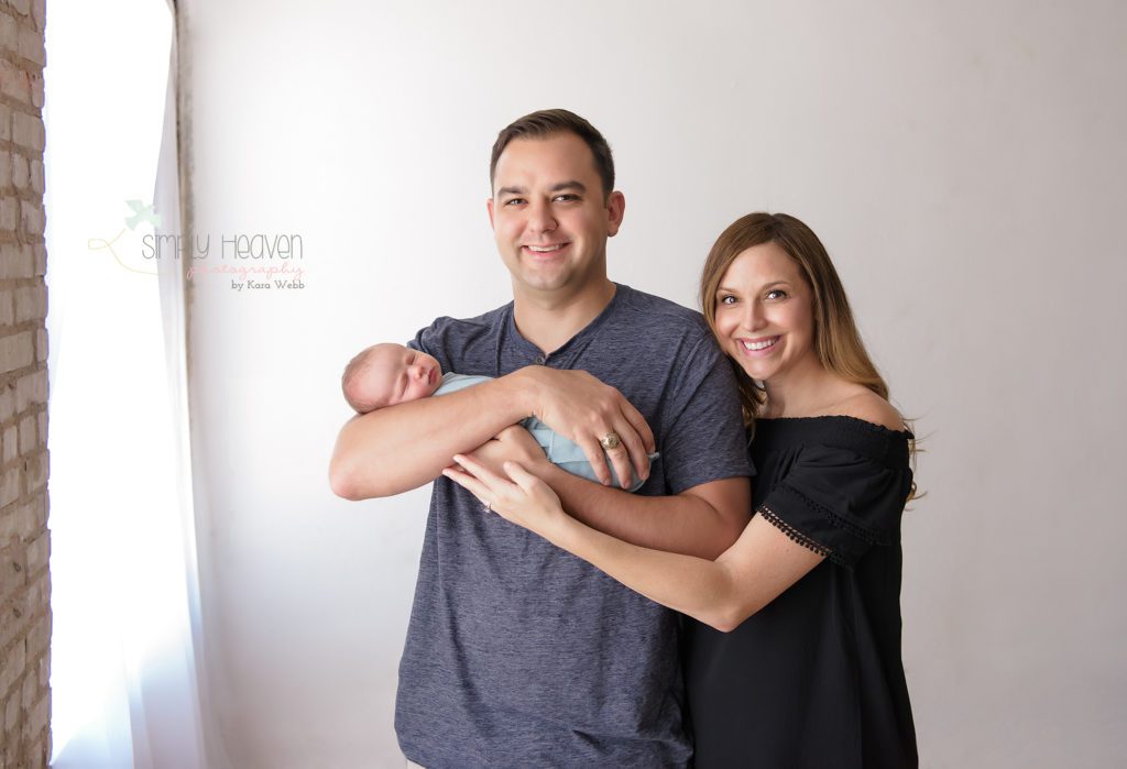 mom and dad with newborn boy